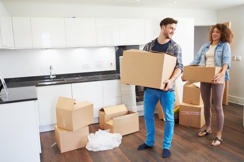 Van moving team preparing items safely before transport