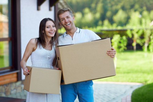 Packed moving boxes and furniture ready for transport in Eastcote