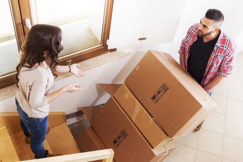 Office furniture and equipment being prepared for a business move
