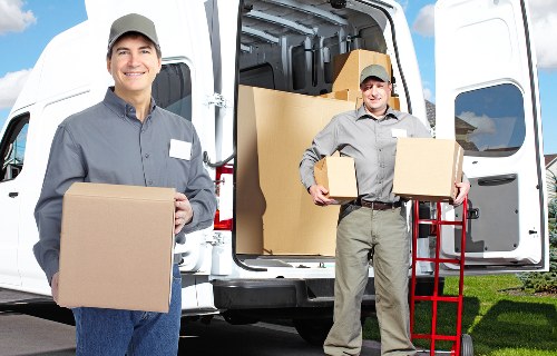 Professional movers loading household items on a local Eastcote street