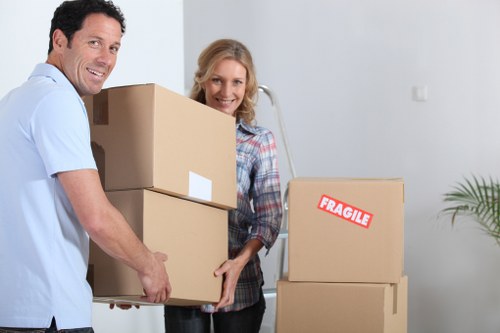 Home removal team assisting with furniture and boxes in Eastcote